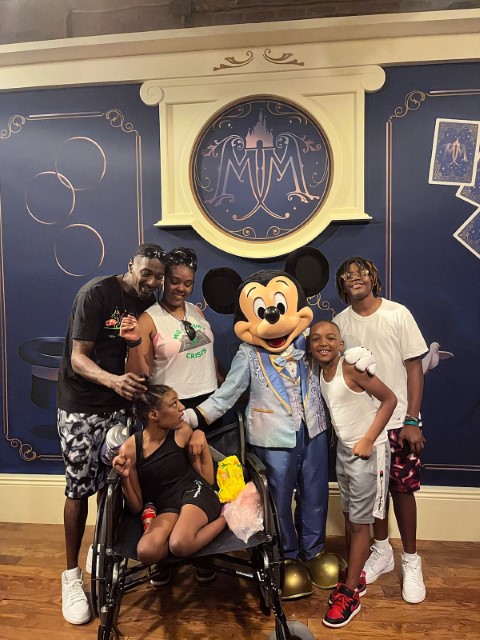 Paris and family with Mickey Mouse